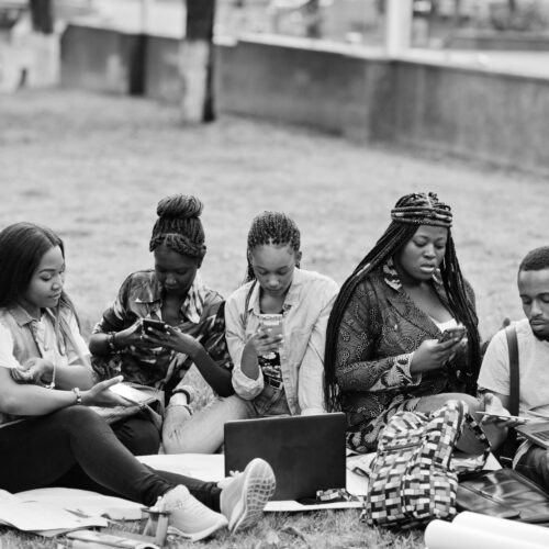 group-five-african-college-students-spending-time-together-campus-university-yard-black-afro-friends-making-with-mobile-phones-education-theme